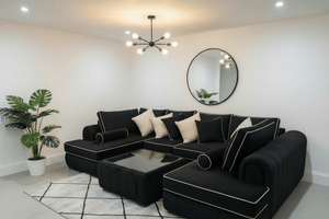 Lilly U Shape Sofa in modern velvet with white trims and deep cushions, paired with a glass coffee table by The Sofas Studio.